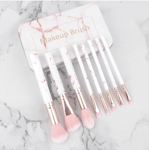 Detail of 8pcs marble makeup brushes with rose gold ferrules in a matching tin box