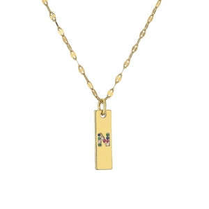 Detail of gold rectangular pendant with colorful cubic zirconia letter N on link chain