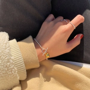 S925 sterling silver beaded bracelet with gold heart charm and toggle clasp on wrist