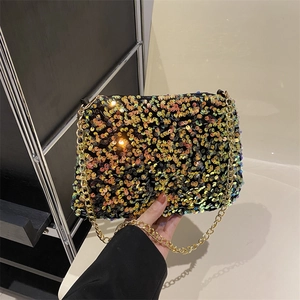 Sparkly sequin rectangular crossbody bag with a golden chain strap in hand display