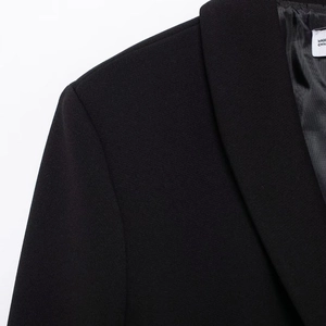 Women's black city commuter blazer with classic notched lapel and padded shoulder detail
