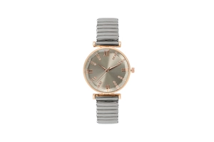 Detail of rose gold case with Roman numerals and silver stretchy metal watch band