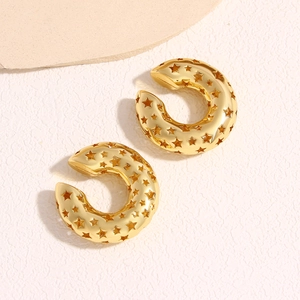 Polished 18k gold plated C-shaped earrings with hollow star patterns on a white background
