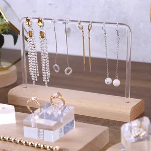 Minimalist wood and acrylic earring display stand with multiple hanging holes for jewelry