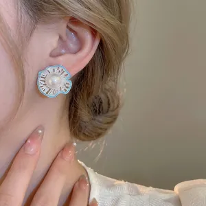 French vintage pearl stud earrings with blue enamel flower petals and hollow silver finish