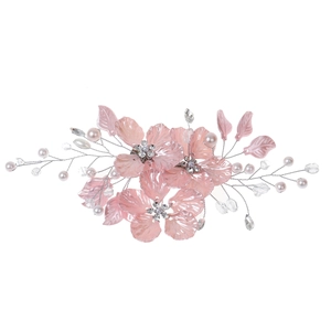 Detail of bridal hair clip with pink shell petals, pearls and crystals on silver wire