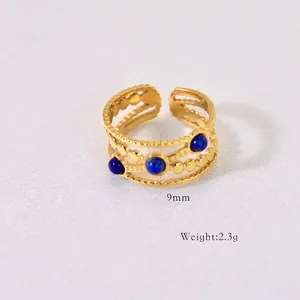 Detail shot of 9mm wide gold bohemian ring with three blue stones and weight specs