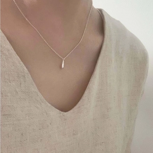 Elegant 925 sterling silver water drop pendant necklace shown on a female model