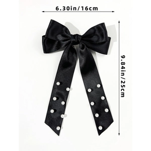 Detail of elegant black satin bow hair clip with pearls and dimensions 16x25cm