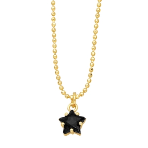 Detail of a gold bead chain featuring a black star pendant with meticulous claw setting