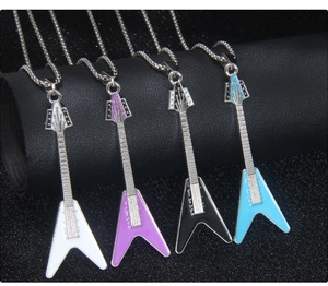 Detail of four guitar-shaped necklaces in white, purple, black, and light blue oil-drop finish