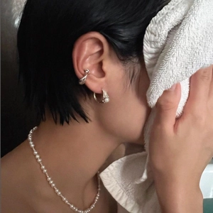 Minimalist 925 sterling silver pearl jewelry set with necklace and earrings on model