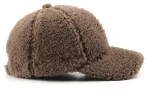 Side view of dark brown plush baseball cap with fluffy faux shearling texture