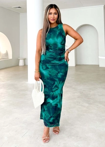 Detailed close-up of green floral print mesh fabric on slim sleeveless maxi dress