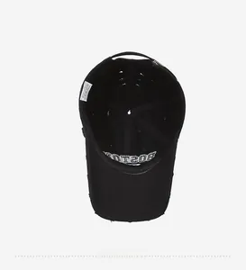 Detail of internal cotton structure and wash label on vintage black baseball cap