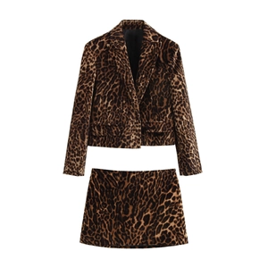 Professional two-piece leopard print suit featuring cropped blazer and mini skirt on white background