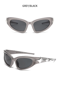 Detail showing cyberpunk cat-eye sunglasses with silver 3D stars and grey/black lenses