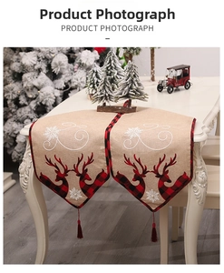 Detailed Christmas table runner featuring reindeer applique embroidery and festive tassels
