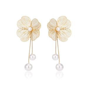 3D hollow flower stud earrings in gold with pearl center and elegant long tassels