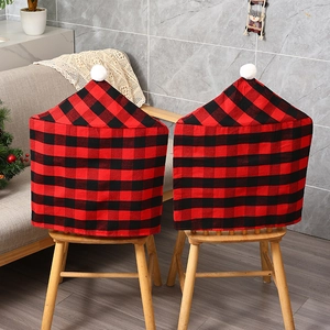 Christmas red and black buffalo plaid chair covers with white pom-poms for festive home decor