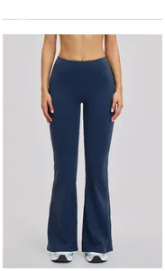 Close-up of badge blue high-waisted flared yoga pants with wide tummy control waistband
