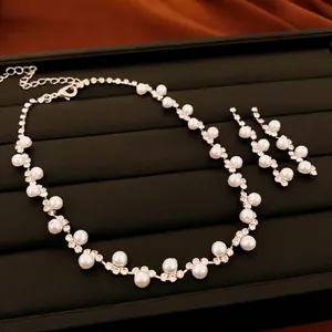 Elegant wavy pearl choker and drop earring set with sparkling rhinestones in silver finish