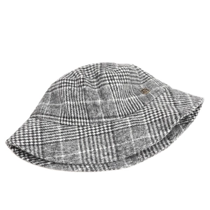 Macro view showing the detailed grey plaid wool texture of this vintage bucket hat