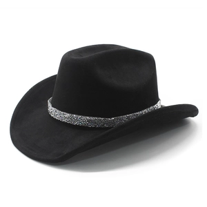 Macro detail of wide brim cowboy hat featuring a sparkling glitter crown band decoration