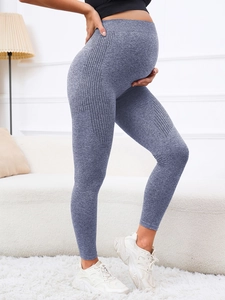 Detailed side view of high waist maternity yoga leggings in grey blue with tummy support