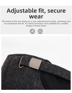 Detail of adjustable metal buckle and leather strap on a winter wool baseball cap