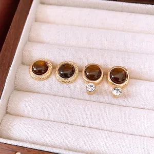 Retro resin round stud earrings in brown cat-eye style with gold-plated rope texture borders