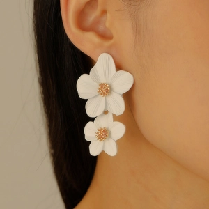 Elegant white floral drop earrings for women with golden stamen and alloy finish