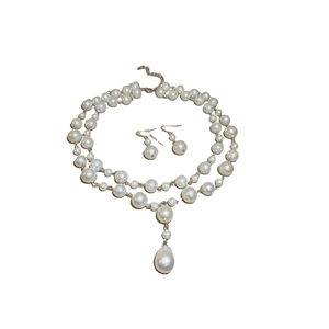 Double-layer pearl necklace and drop earring set featuring large teardrop pearl pendants