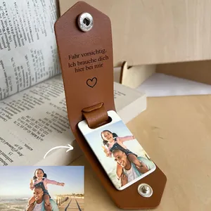 Close-up of brown textured leather photo keychain with custom picture and silver snap