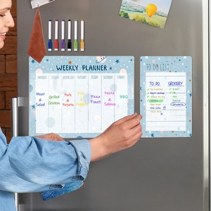 Magnetic weekly planner and to-do list set with space theme design on a fridge
