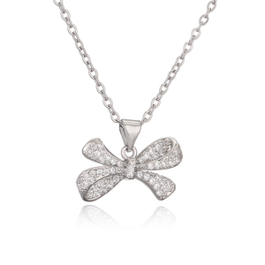 Elegant silver bow pendant necklace with sparkling zircons on a clean white background