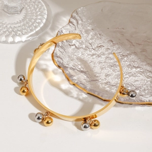 18K gold-plated stainless steel open bangle with mixed gold and silver bead charms