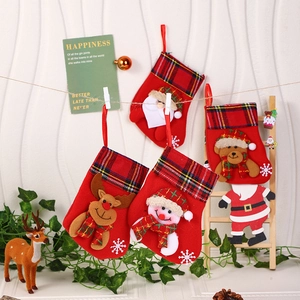 Set of four plush Christmas stockings with Santa, reindeer, and snowman 3D patterns