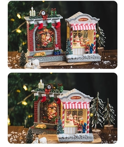 Detail of Christmas music box with candy shop design and fireplace scene lighting