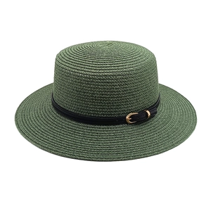 Detailed texture of dark green boater straw hat with black leather band and gold buckle