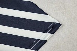 Detail of blue and white striped knit fabric showing high-quality double-stitch hem sewing