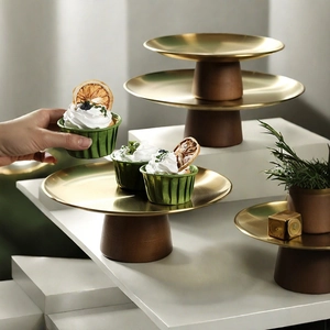 Three-tier dessert stands with brass metal plates and dark brown wooden bases