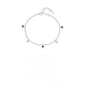 Macro detail of S925 sterling silver chain with emerald beads and star zircons