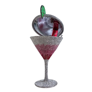 Detail of crystal martini clutch showing open interior with mirror and lipstick slot