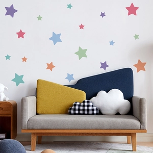 Detailed view of colorful star wall stickers in a cozy nursery room setting