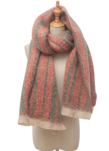 Detail of multi-color striped brushed cashmere-like scarf tied on a wooden mannequin