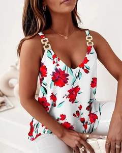 Close-up of a floral print tank top with golden metal chain straps and V-neckline detail