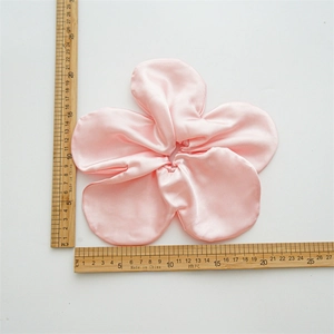 Pink oversized floral scrunchie in satin silk finish with 20cm scale measurement