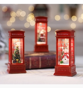Three red Christmas telephone booth LED lanterns featuring Santa, snowman, and tree