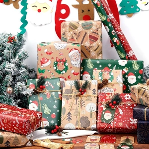 Christmas gift wrapping paper set with Santa and snowflake patterns including twine tags